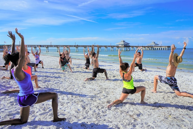 Group fitness training at the beach